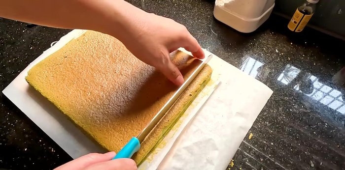 Once baked, let the cake cool slightly. Trim the edges of the cake. (240.879)