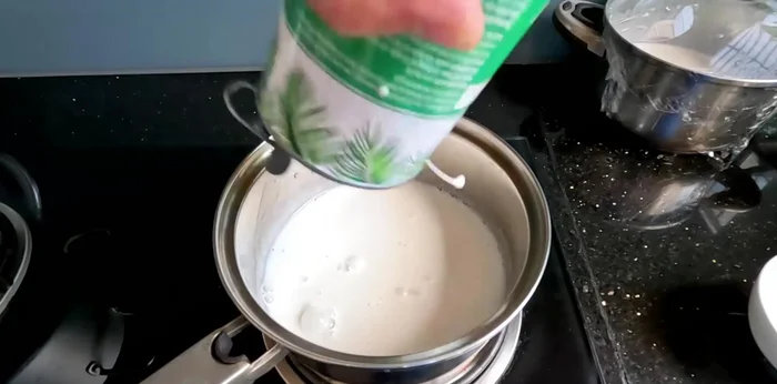 Make the coconut milk topping. Combine coconut milk, sugar, and a few pandan leaves in a saucepan. Cook over medium heat for 10-15 minutes until slightly thickened.