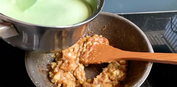 Combine the banana mixture and flour. Add the rested flour mixture to the mashed bananas, stirring vigorously for 5-10 minutes until well combined. (Note: the heat from the bananas will partially cook the flour).