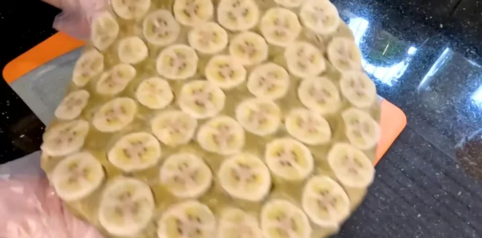 Cool and serve. Let the cake cool completely before slicing and serving. Top with coconut milk topping, sesame seeds and roasted peanuts.