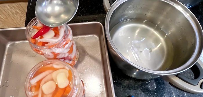 Once cooled, pack the softened radish and carrots into a clean jar. Pour the cooled vinegar mixture over the vegetables, ensuring they are fully submerged.