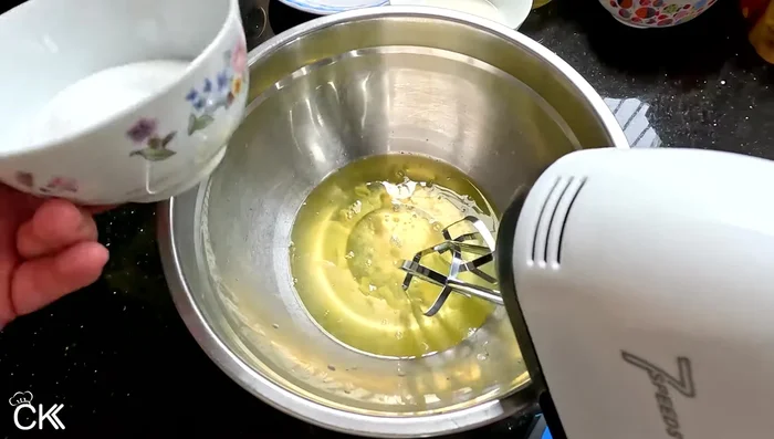 Beat egg whites with a mixer on low speed until foamy, gradually adding sugar until dissolved. [113.2]