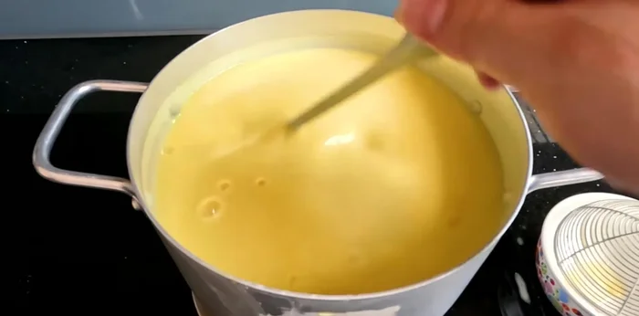 Add condensed milk: Once the corn milk is thick, add condensed milk (50-150g depending on desired creaminess). Cook and stir for another 2-3 minutes.