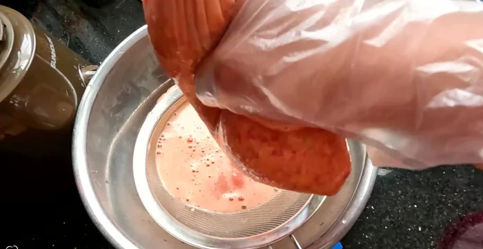 Strain (optional): If you don't have a squeeze bag, use a sieve to remove excess water from the blended mixture. Squeeze to extract as much water as possible.