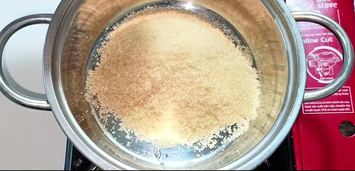 In a pot, combine sugar, water, salt, and soy sauce. Cook over high heat, stirring constantly, until the sugar dissolves completely and the mixture begins to simmer.