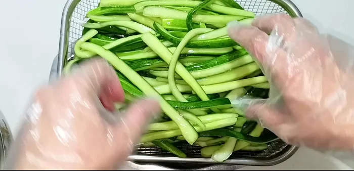 In a clean, dry jar, layer the cucumbers, then add the cooled soy sauce mixture, garlic, and chili. Ensure the cucumbers are submerged in the liquid.