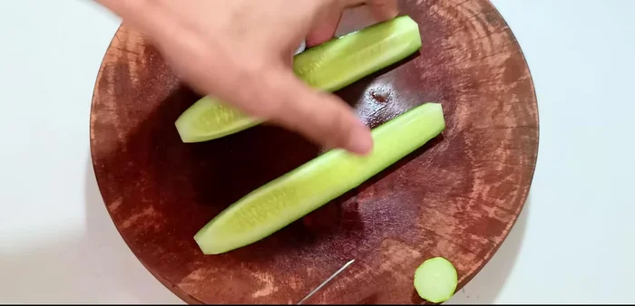 Cut the cucumbers lengthwise into 2-3 pieces depending on size.