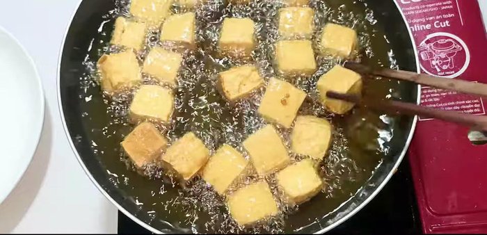 Fry the tofu: Heat oil in a pan. Fry tofu until edges are crispy.