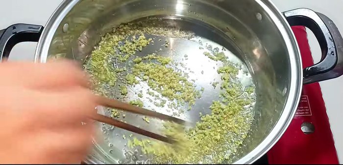 Sauté aromatics: Add oil to the pot, then add remaining lemongrass, shallots, and chili. Stir-fry briefly.