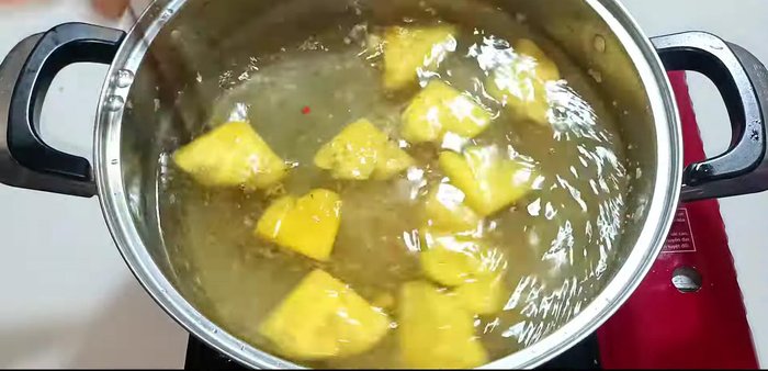 Braise the vegetables: Add coconut water, stir well, and add marinated vegetables. Add more coconut water to cover. Bring to a boil, then reduce heat, cover, and simmer for 5 minutes.
