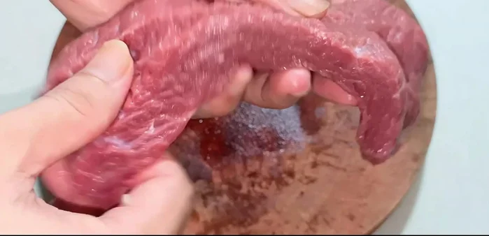 Cut beef against the grain into bite-sized pieces. (77.68)