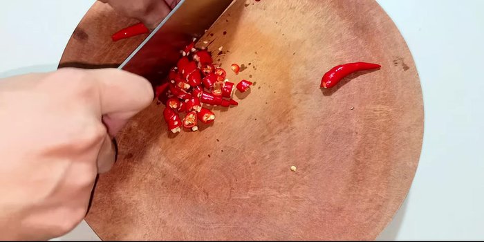 Blend chili peppers until pureed. Note: Adjust chili amount for desired spiciness. Remove seeds for less heat.