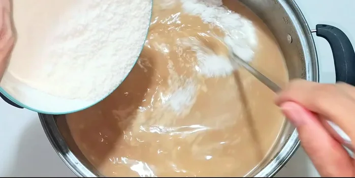 In a separate bowl, combine cream powder with a little bit of the tea mixture until dissolved then add all the milk and stir well.