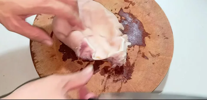 Cut and prepare the pig's hands and tongue for rolling. Cut the tongue into strips.