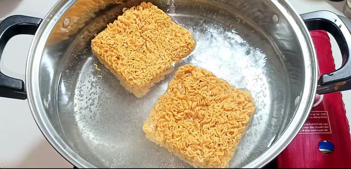 Blanch noodles in boiling water until slightly softened, then drain.