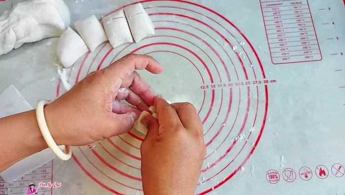 Add the filling to the center of each dough circle, seal tightly, and shape as desired.