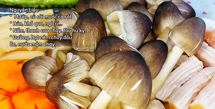 Assemble the hot pot: Add straw mushrooms, crab sticks, and the fried Huu Ki leaf to the simmering broth.