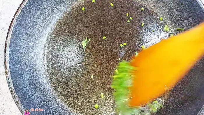 Fry chopped coriander until fragrant.