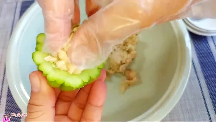 Stuff the bitter melon: Fill the halved bitter melon with the prepared filling. Steam until cooked through.