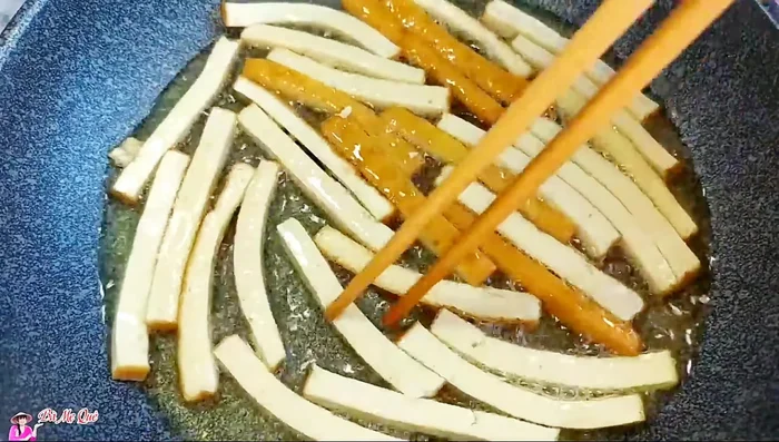 Prepare the fried tofu: Cut tofu into sticks, fry until golden brown and crispy.
