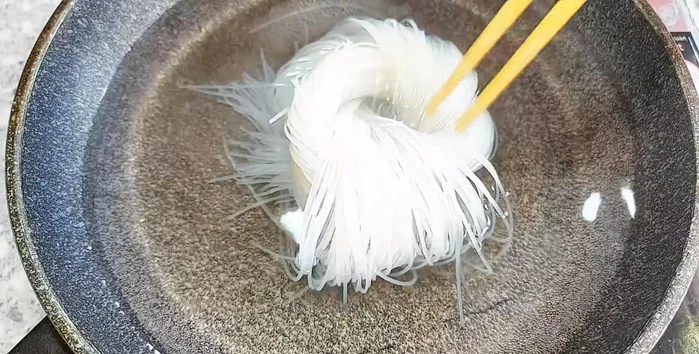 Boil water and blanch the noodles until soft. Add a little cooking oil to prevent sticking if not eating immediately.