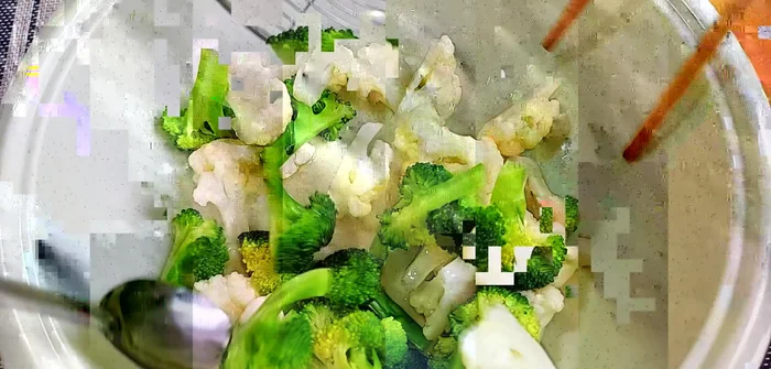 In a bowl, combine the cooked cauliflower and broccoli with the dressing. Mix well, let it sit for about 5 minutes to allow the vegetables to absorb the dressing, then drain excess liquid.