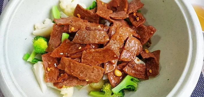 Add the stir-fried vegetarian beef jerky to the cauliflower and broccoli mixture. Mix thoroughly.