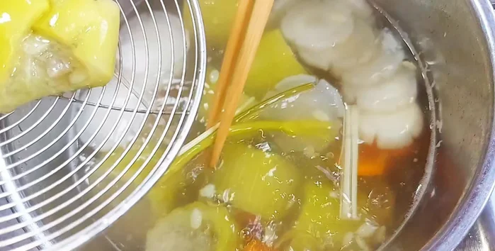 Remove squash from the broth, scoop out seeds, and add the fried tofu and stir-fried vegetarian beef.