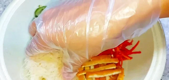Assemble the fish sauce: Combine the cooled sugar mixture, chili strips, tofu strips, dried papaya, and sun-dried cucumber. Mix gently. (193.159)