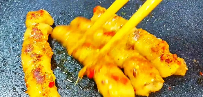 Grill over low heat until noodles are curled, slightly dry, and golden brown with a fragrant smell.