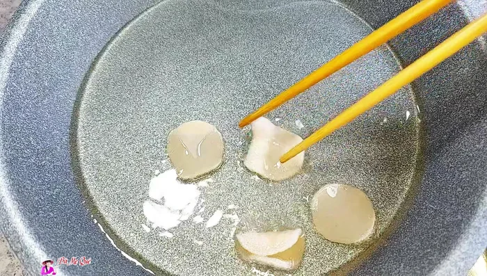 Heat a little oil and fry rice crackers until golden brown.