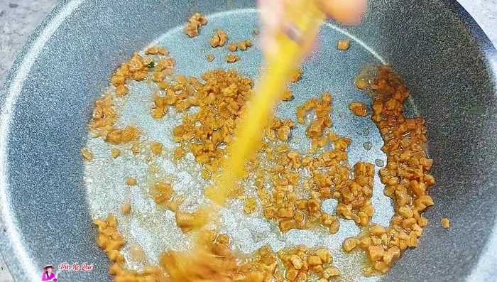 Add the boiled corn and stir-fry to absorb the spices.