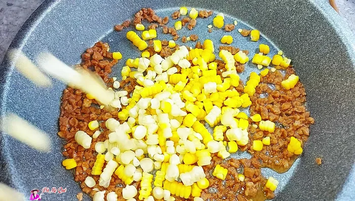 Add a little more sugar and vegetarian seasoning. Stir-fry until the corn absorbs the flavors.