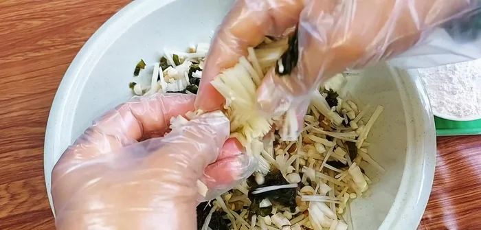 Mix all chopped ingredients well. If too wet, put in a cloth bag and squeeze dry.