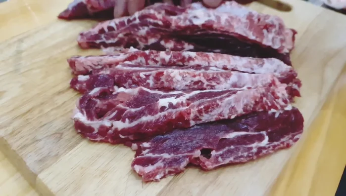 Gently pound the beef slices with a meat hammer to further tenderize them.