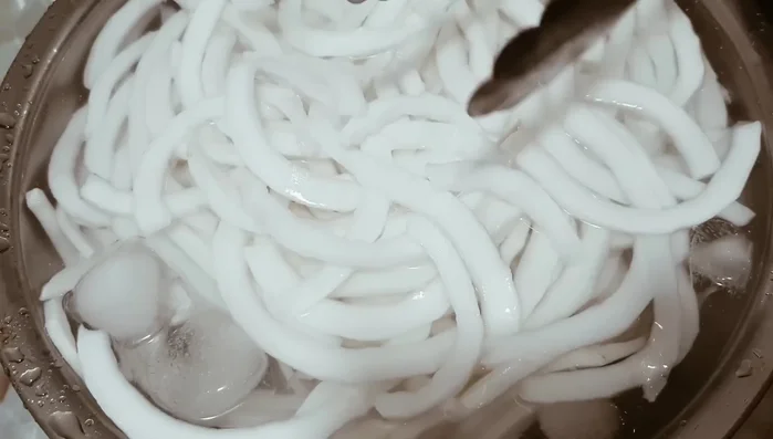 Drain the coconut in a basket.