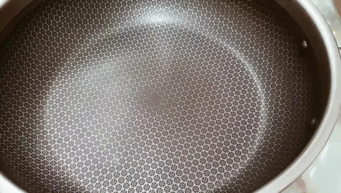 Cook the mixture in a pan over high heat until it boils, then reduce heat to low. Stir constantly to prevent burning.