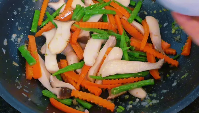 Pour in the mixed sauce and cook over low heat for a few minutes to let the flavors blend.