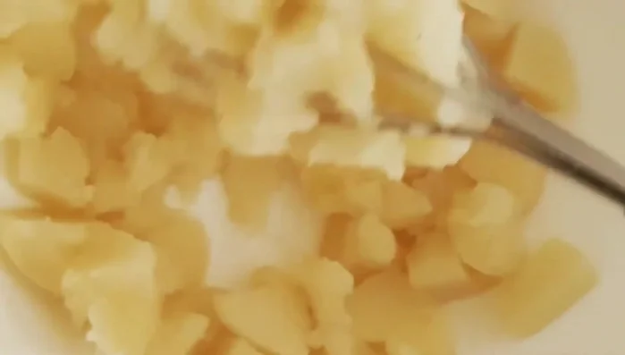 Once cooked, mash the steamed potatoes in a bowl.