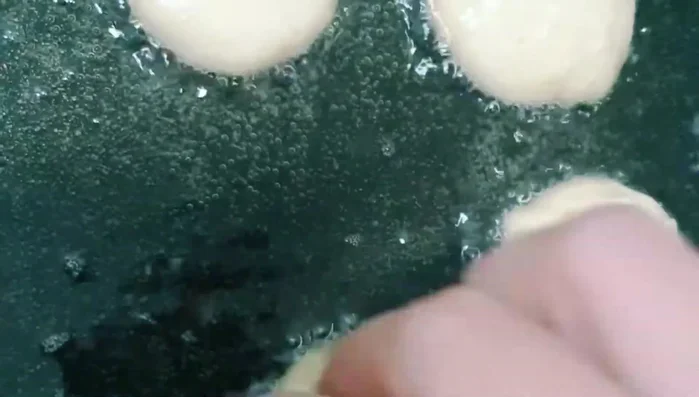 Heat oil in a pan until it boils.