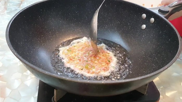 Start by heating up a frying pan with some oil.