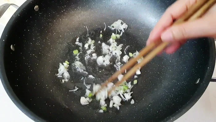 Add vegetarian seasoning powder and sugar. Stir-fry until well combined.