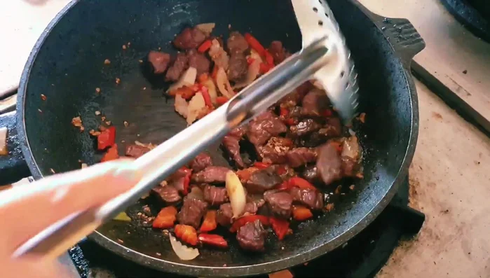 Add bell peppers and onions; stir-fry for about 2 minutes. (554.06)