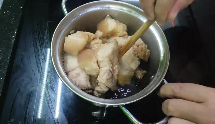 Season with salt and fish sauce. Add purple onion (optional, omit if sensitive to garlic-like flavors).