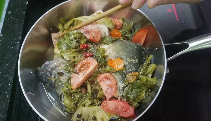 Bring to a boil, then simmer for about half an hour until fish is soft and flavors have melded.