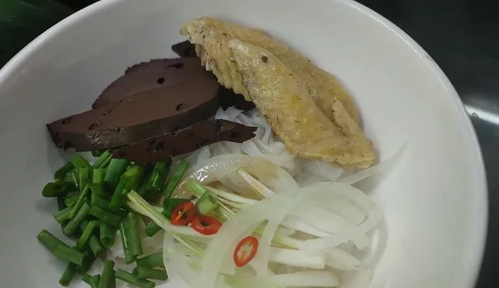 Pour the pho broth over the ingredients. Add a little fish sauce and MSG to enrich the flavor.