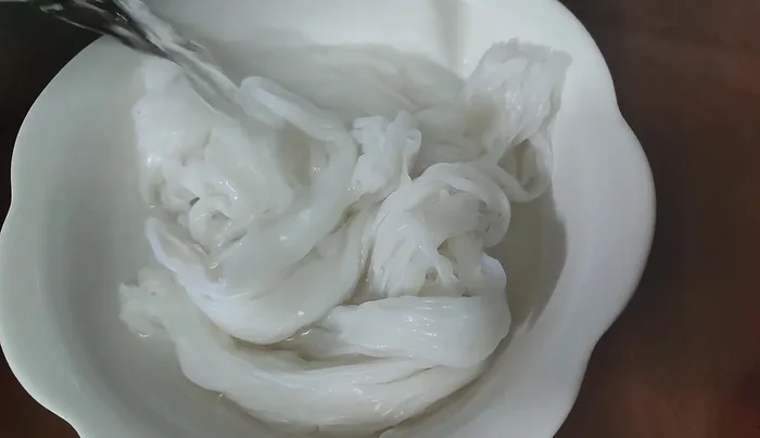 Once the chicken is cooked, flip it over to ensure even cooking.