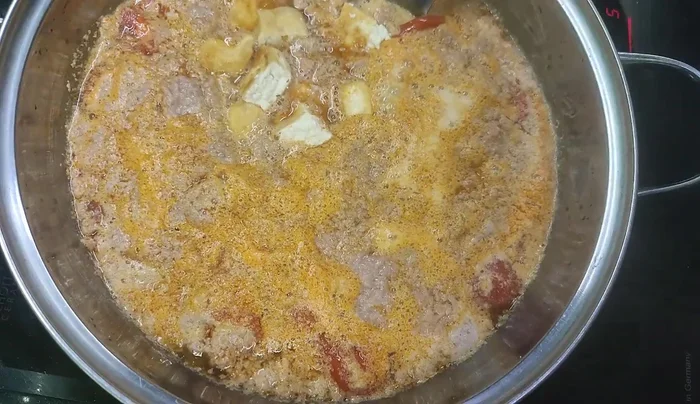 Add pre-fried beans and sausage.