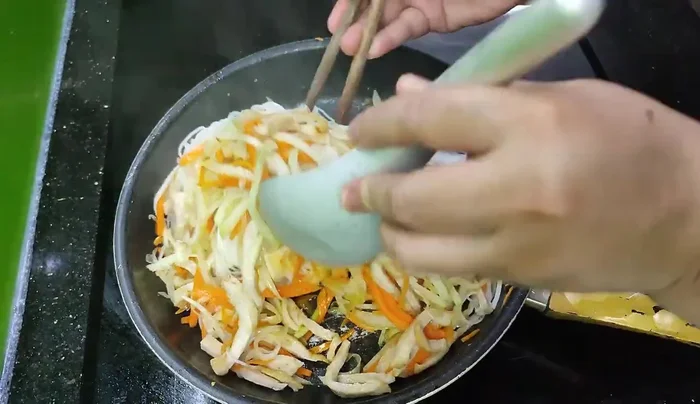 Add the boiled noodles, stir gently and add fish sauce and MSG (optional) before turning off the stove.