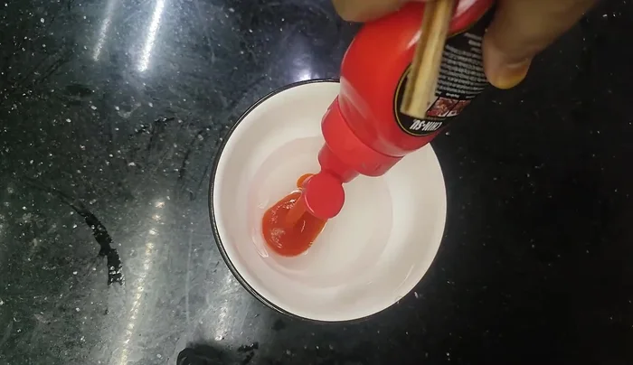 Prepare the sweet and sour sauce: Mix water, sugar, fish sauce, and vinegar (or lemon/lime juice).
